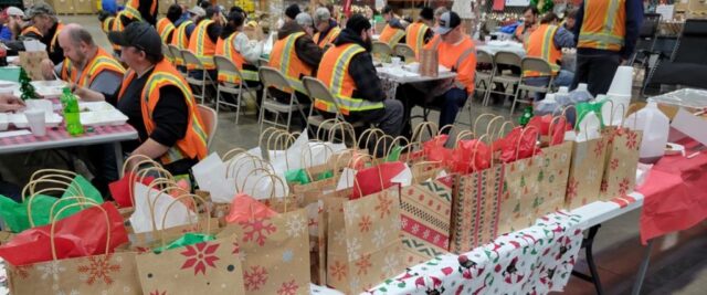 Holiday Appreciation Lunch CLI employee gift packing community service event