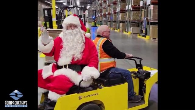 CLI Santa riding through the warehouse